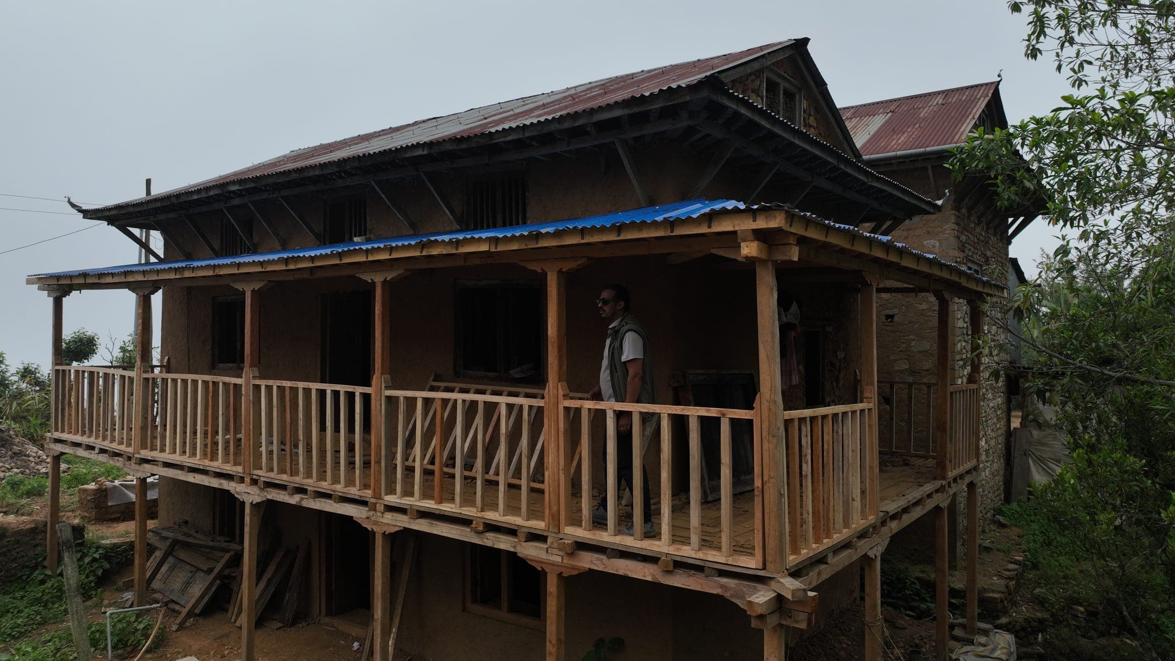 The rebuilt house in Thumka with its new timber balcony